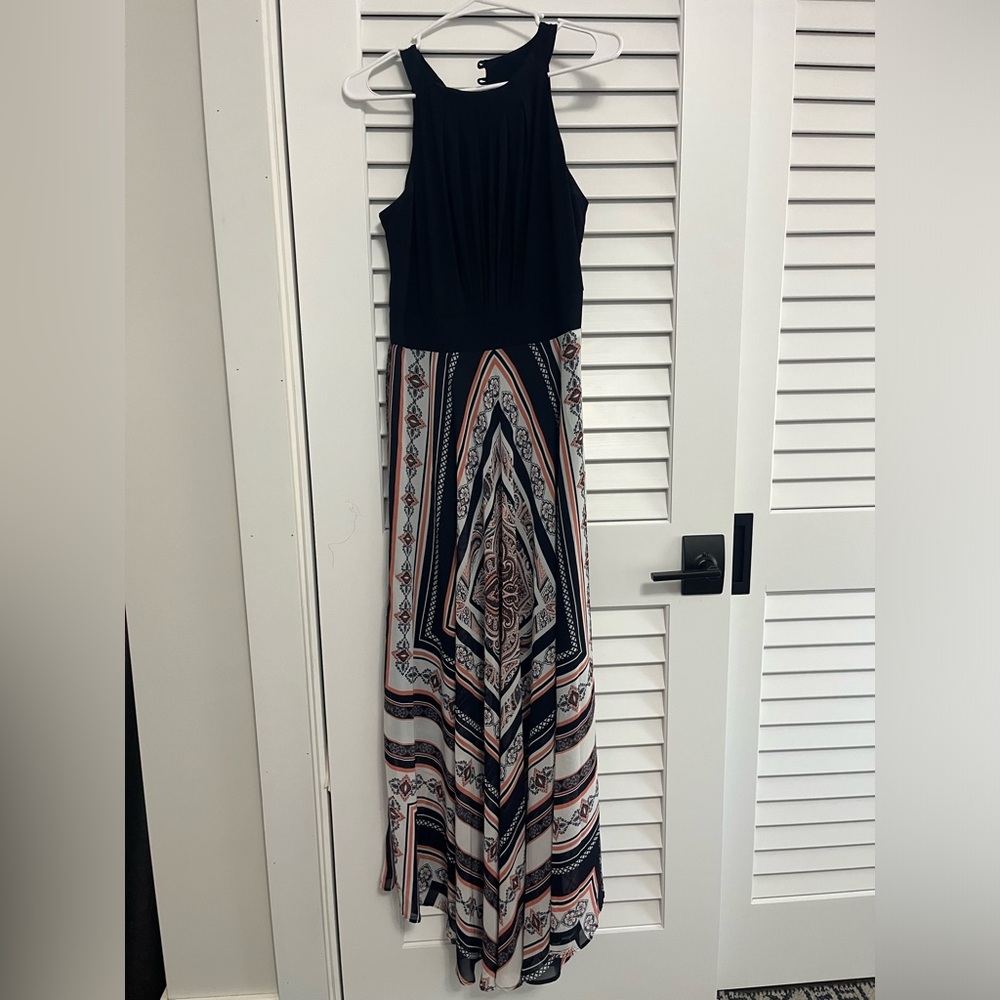 Floor length dress. Design on the bottom half of the dress and solid on the top